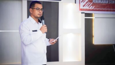 Pj Bupati Bolmut Sirajudin Lasena saat membuka Rapat peningkatan kapasitas tenaga kesehatan dalam penentuan pengukuran balita Stunting