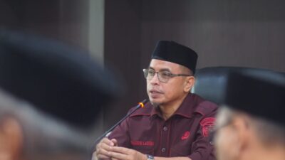 Pj Bupati Bolmut Sirajudin Lasena saat memberi sambutan di penandatanganan perjanjian Kinerja