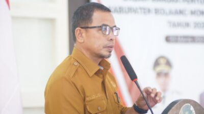 Pj Bupati Bolmut Sirajudin Lasena saat menyampaikan sambutannya di forum perangkat daerah dalam rangka penyusunan RKPD Bolmut Tahun 2025