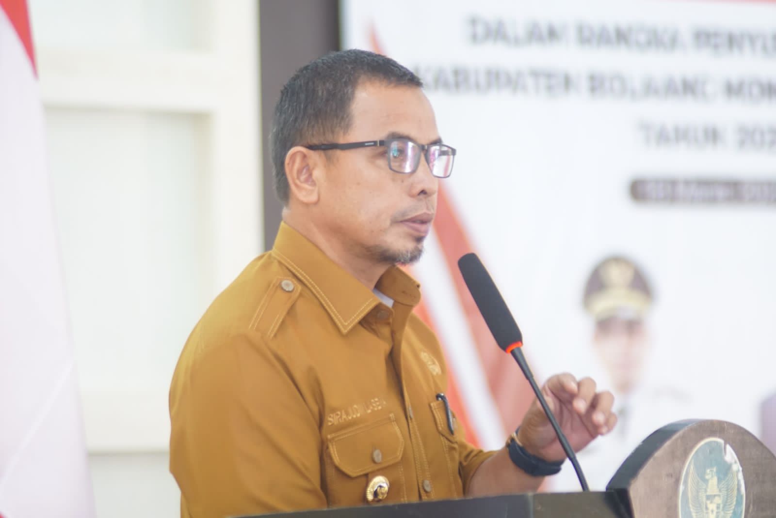 Pj Bupati Bolmut Sirajudin Lasena saat menyampaikan sambutannya di forum perangkat daerah dalam rangka penyusunan RKPD Bolmut Tahun 2025